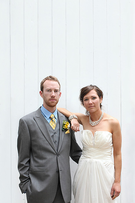 bride and groom white fence portrait - lake minnetonka wedding